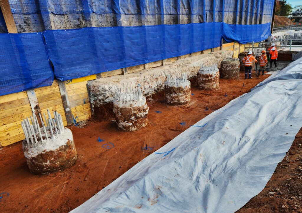 Abutment footing foundation for a large rail bridge